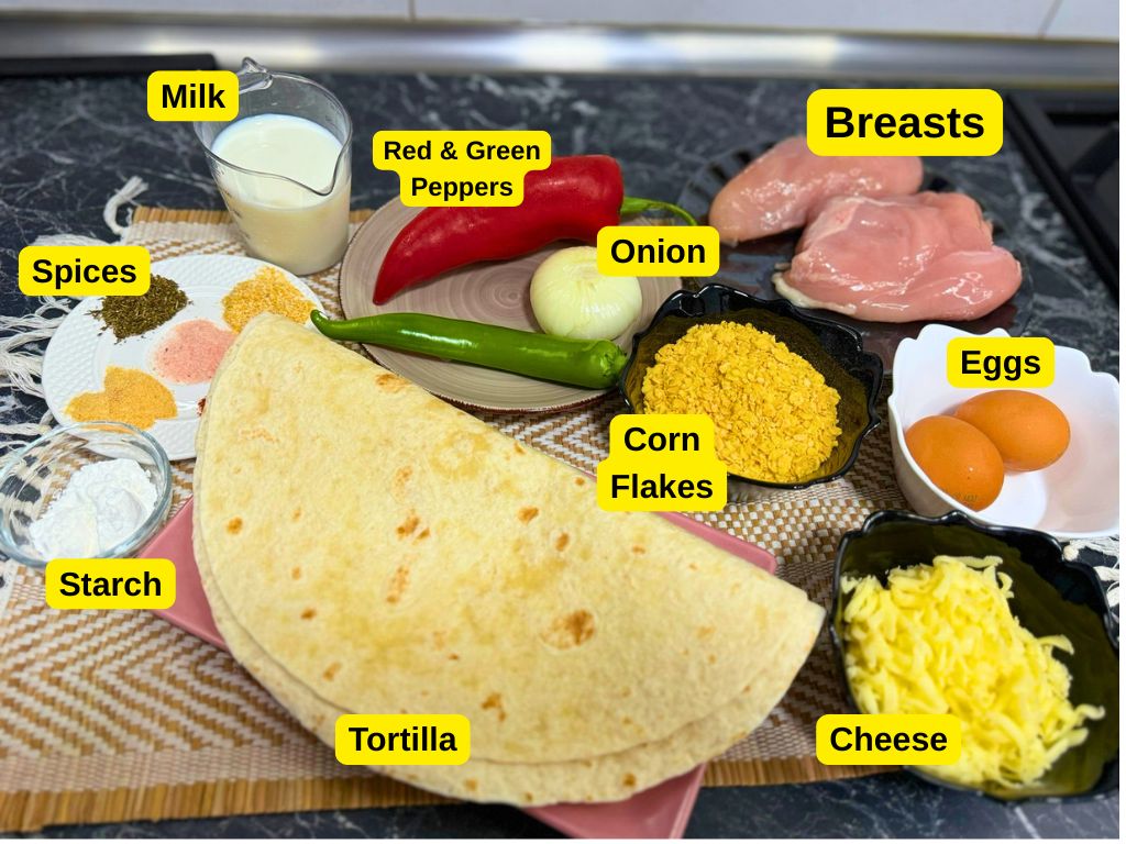 Ingredients for crispy baked chicken tortilla wraps including chicken breasts, onion, peppers, corn flakes, cheese, eggs, tortillas, milk, spices, and starch.