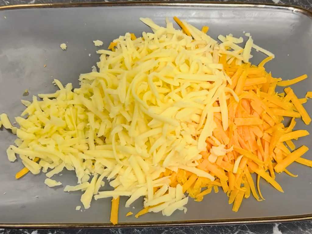 Grated cheddar and mozzarella cheese mixed together for cheesy quesadilla cones