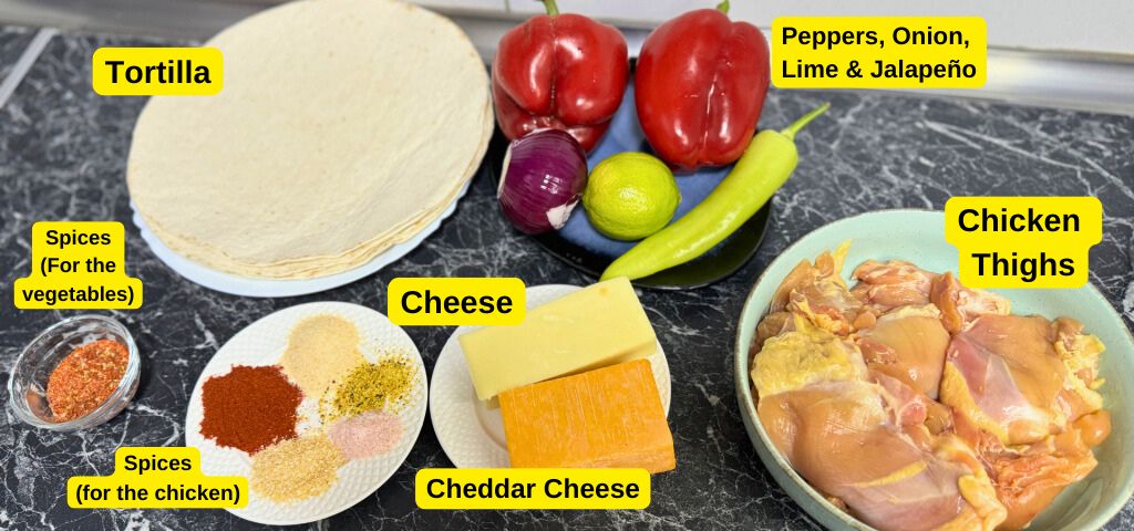 Ingredients for cheesy chicken quesadilla cones including tortillas, chicken thighs, cheddar cheese, peppers, onion, lime, jalapeño, and spices