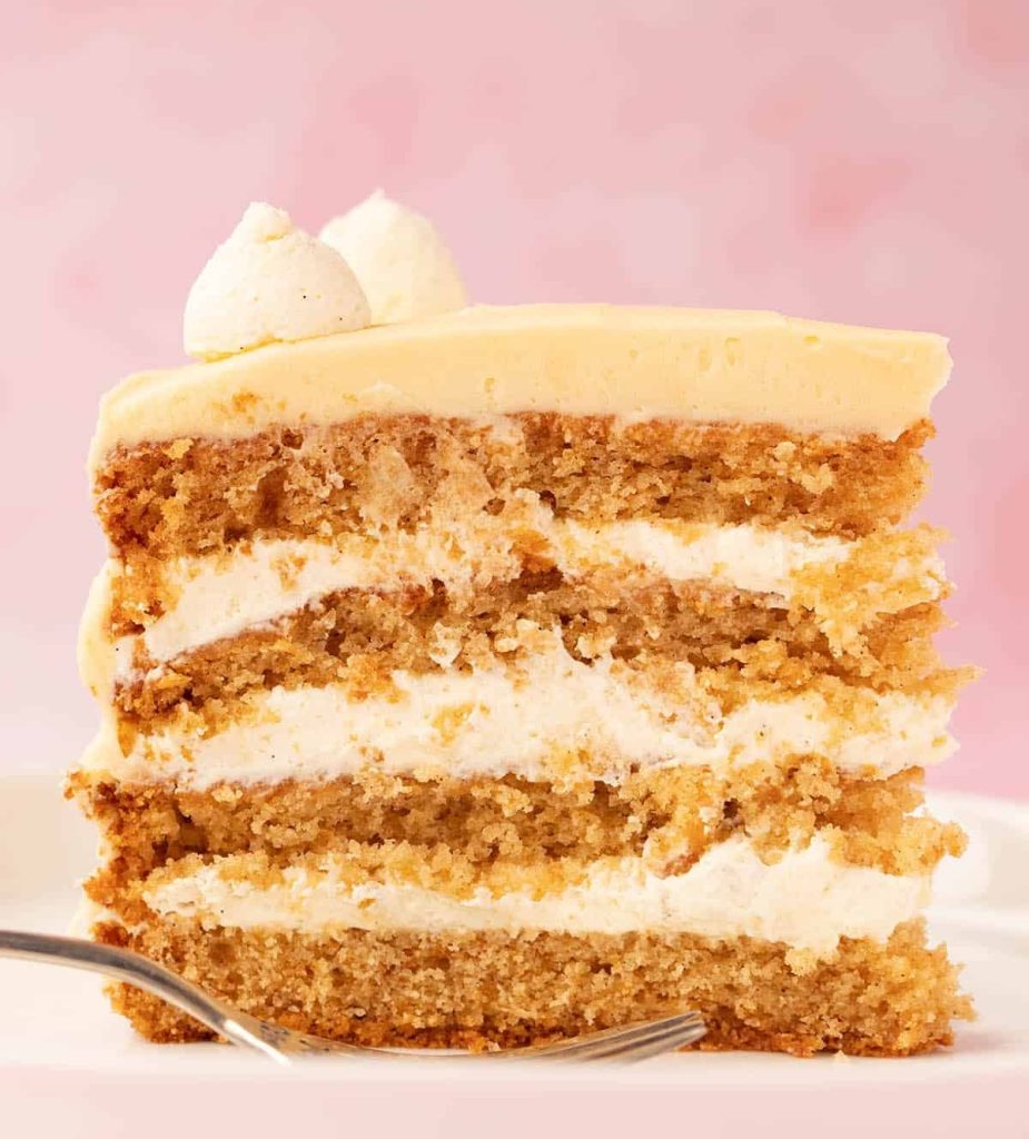 Slice of honey bun cake with creamy filling and moist layers – Russian honey cake recipe