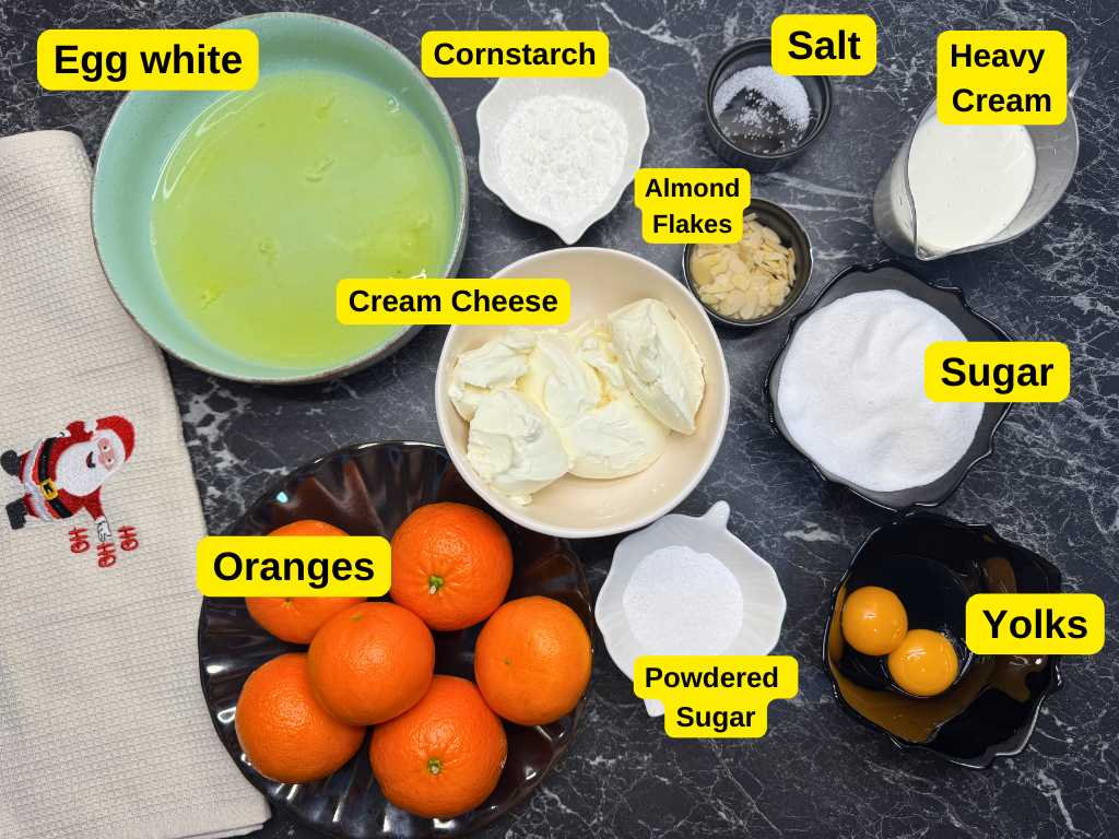 Ingredients for mandarin meringue roll including egg whites, sugar, cream cheese, mandarins, and heavy cream