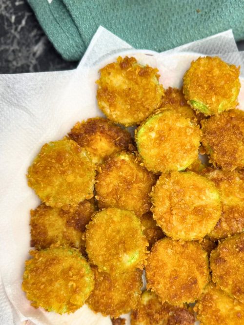 a plate full of crispy fried zucchini