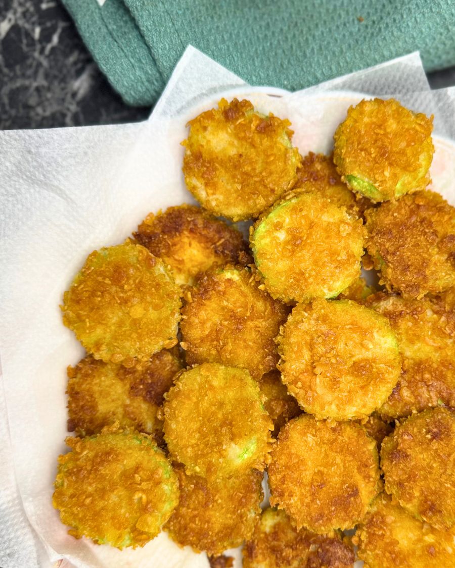 a plate full of crispy fried zucchini