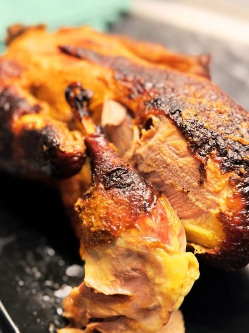 Oven roasted whole duck with crispy skin and caramelized honey soy glaze ready to serve