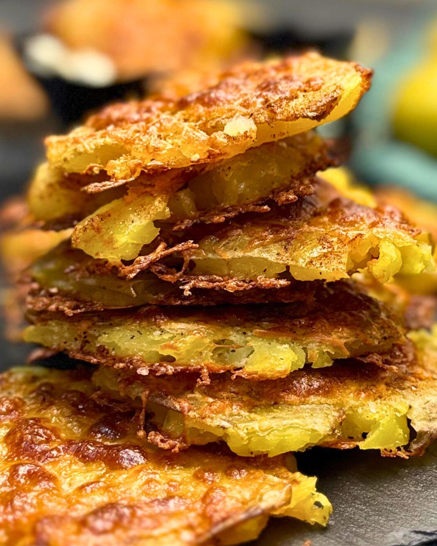 Front shot of several pieces of Cheesy Smashed Potatoes