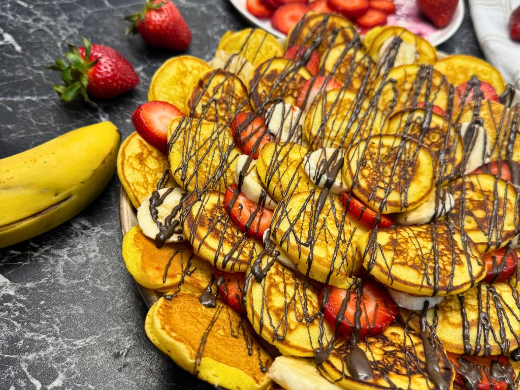 A plate with Chocolate Fruit Waffle