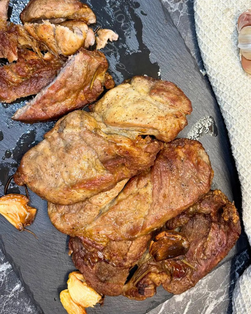 Crispy Air Fryer Pork Neck on Slate Board