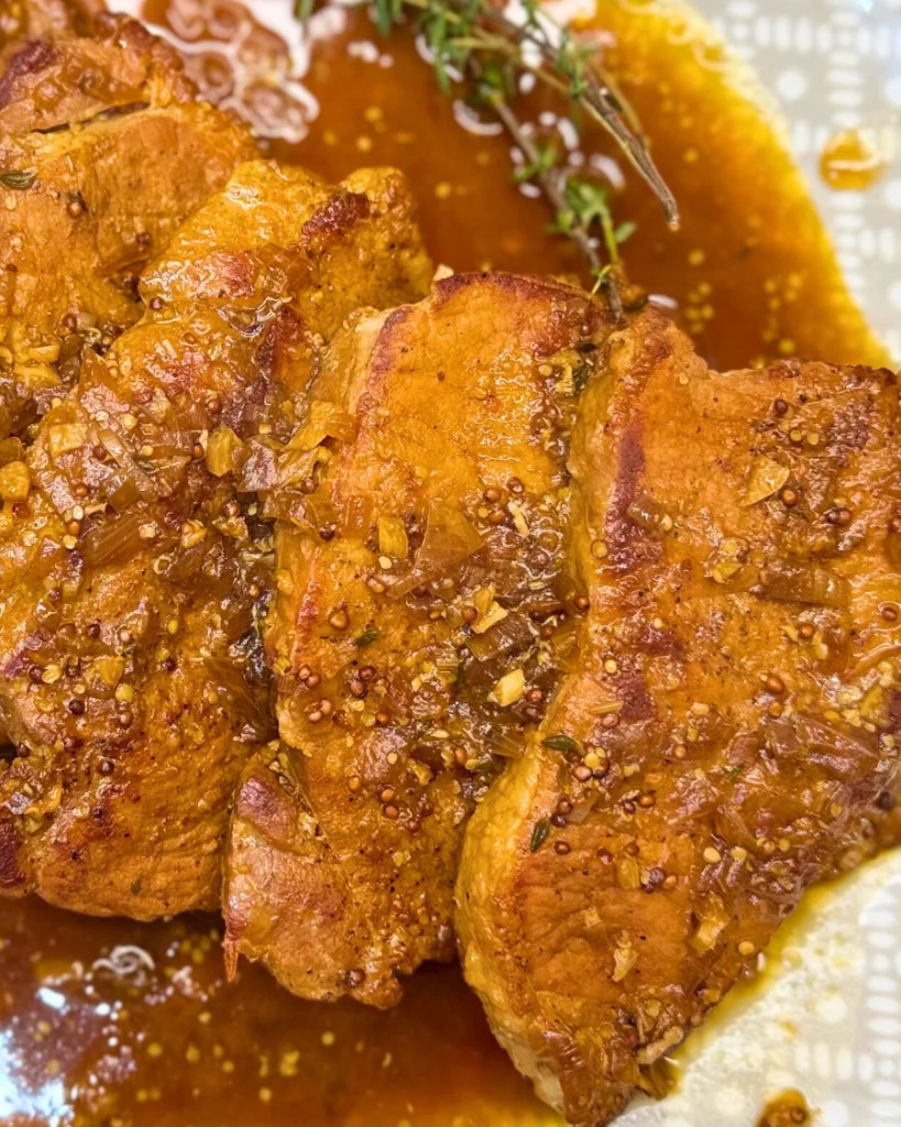 Tender braised pork in dark beer sliced and served with rich glossy sauce