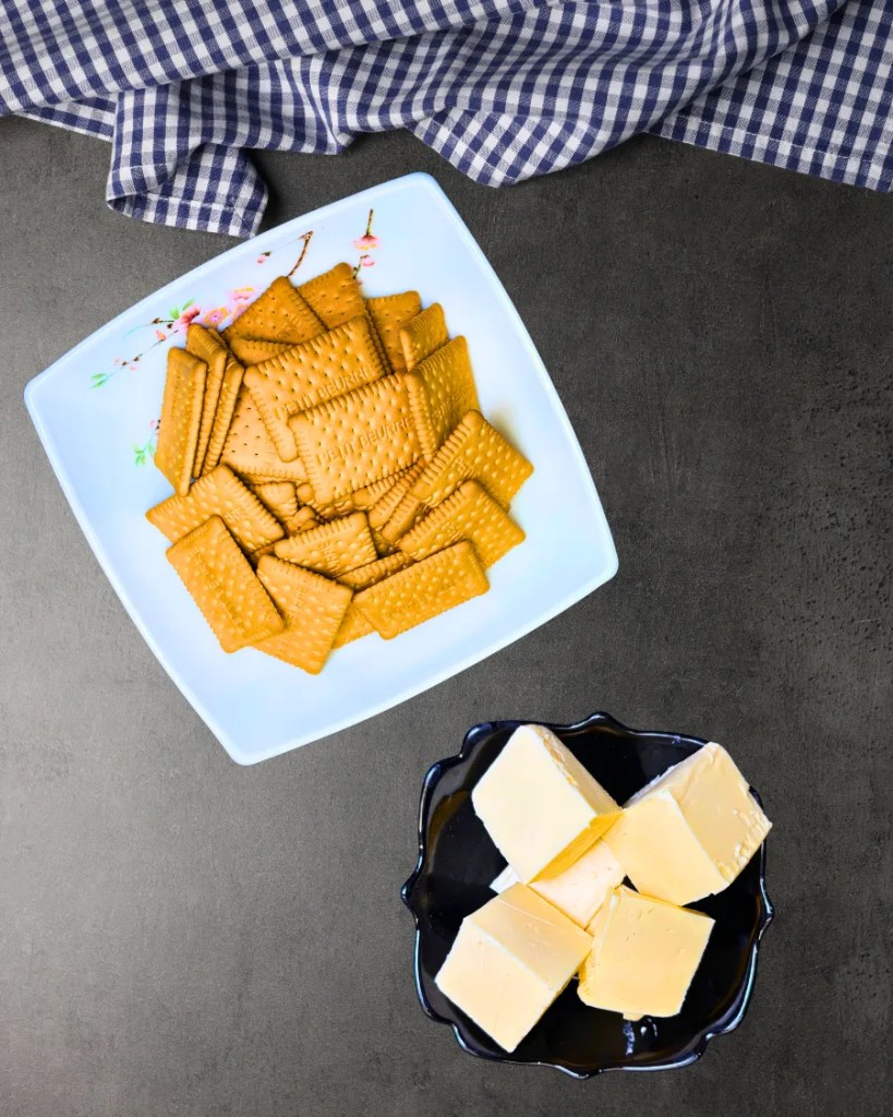 Marie biscuits and melted butter for strawberry cheesecake biscuit base