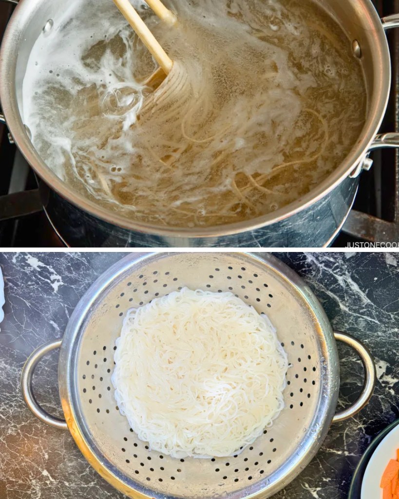 Rice noodles boiling in a pot of water and then drained in a metal colander, ready for chicken stir fry with rice noodles.