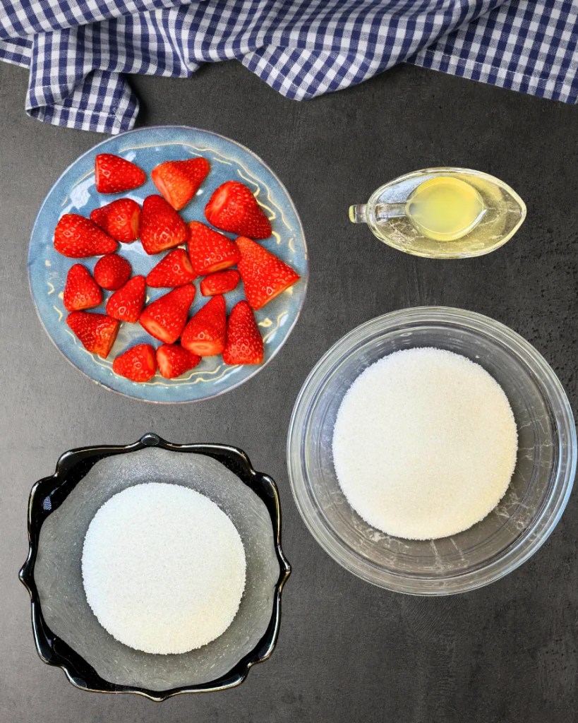 Fresh strawberries, sugar, lemon juice, and cornstarch for homemade strawberry cheesecake topping
