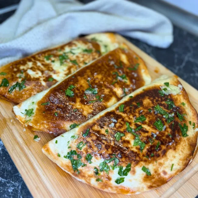 crispy tortilla wrap with chicken and cheese close up