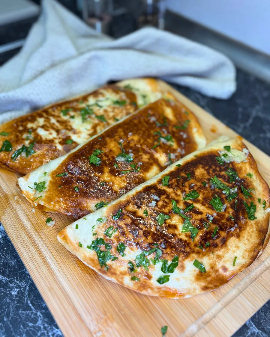 crispy tortilla wrap with chicken and cheese close up