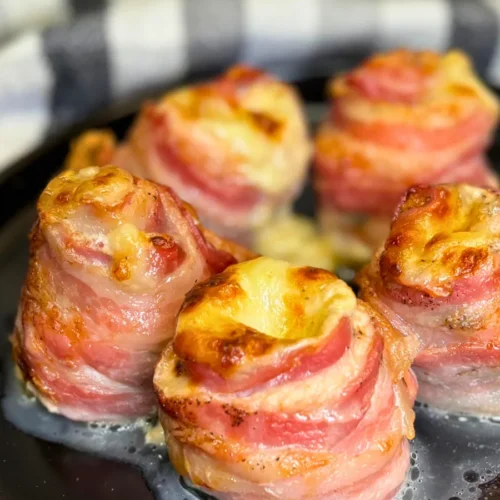 Golden baked chicken bacon mozzarella roll ups with crispy bacon and melted mozzarella cheese.