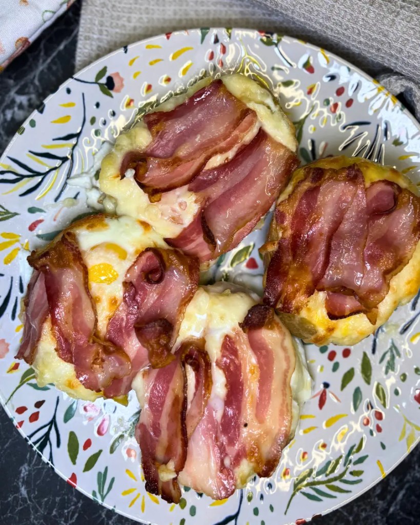 Golden baked potato boats topped with melted cheese and crispy strips of bacon.