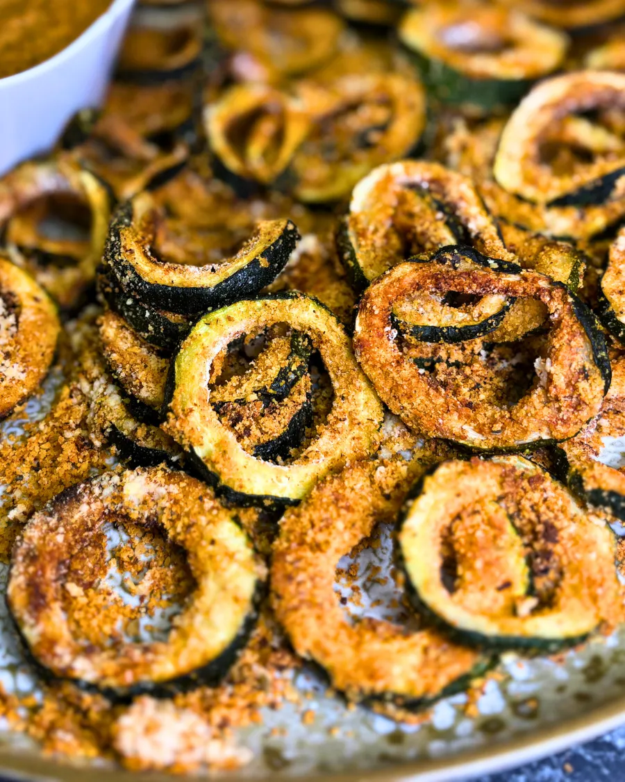 Close-up of crispy parmesan zucchini rings cooked in the air fryer until golden and crunchy